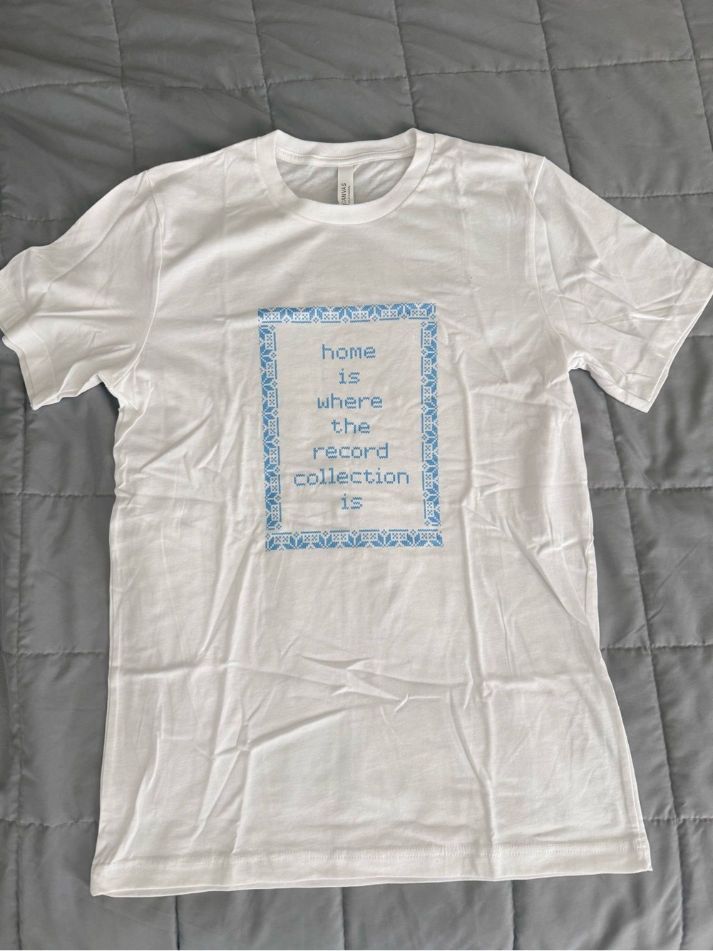 Bella Canvas White Short Sleeve Tee “home is where the record collection is”